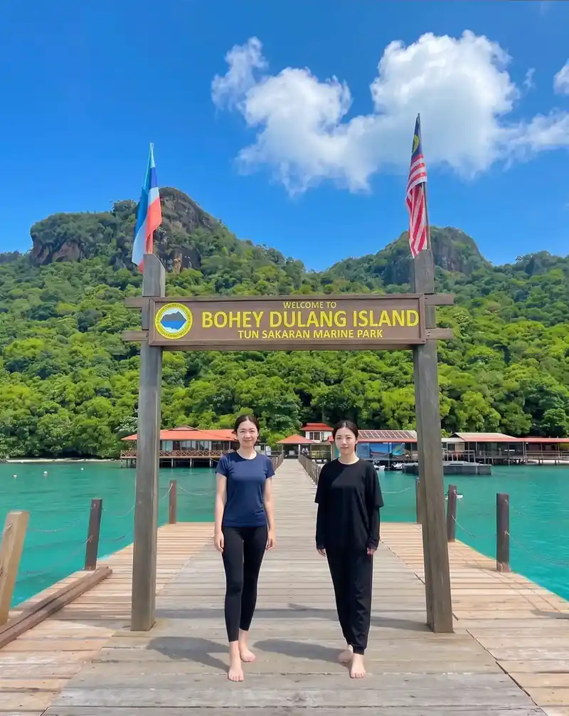 Hiking the famous Bohey Dulang trail for island views with Dreamy Wave Dwelling Resort in the Semporna Islands area.